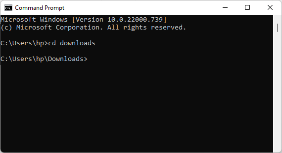 Windows Command Prompt showing the CD command used to navigate to the Downloads folder containing the Velixo installer
